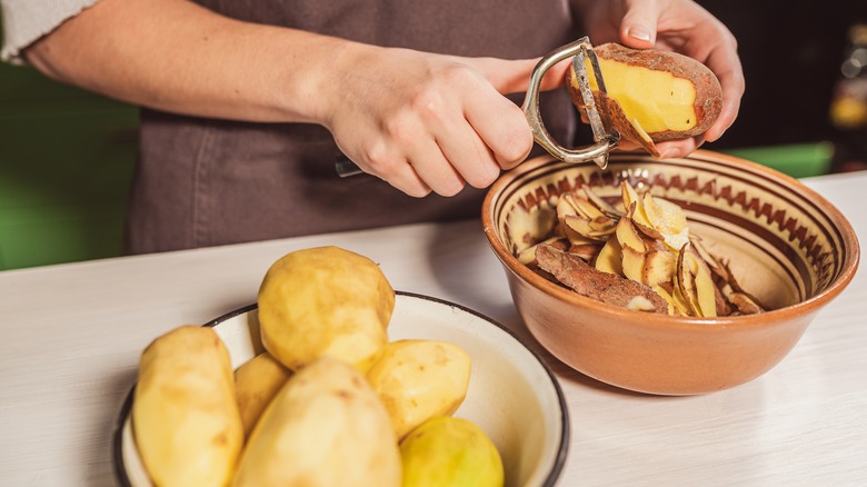 Cook prepping potatoes