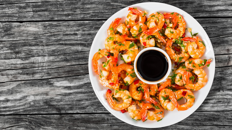 plate of cooked shrimp with soy sauce