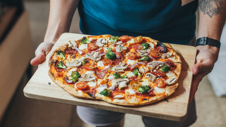 Pizza on wooden tray