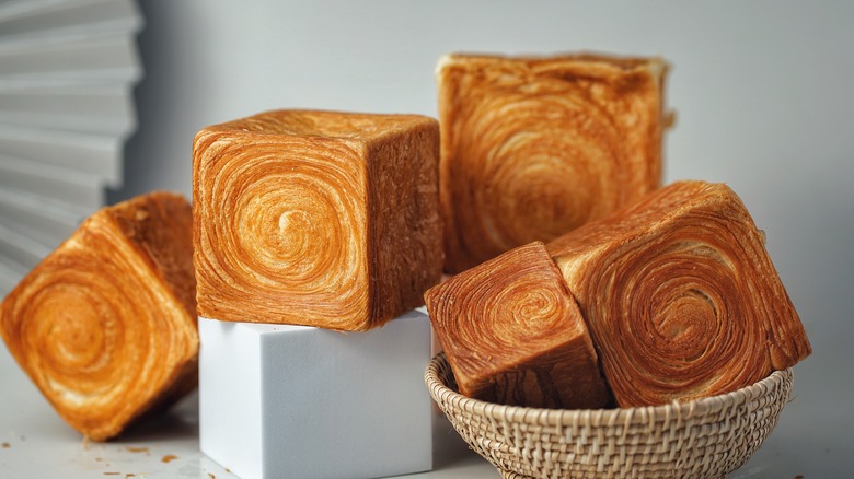 Cube croissants in basket and on surface