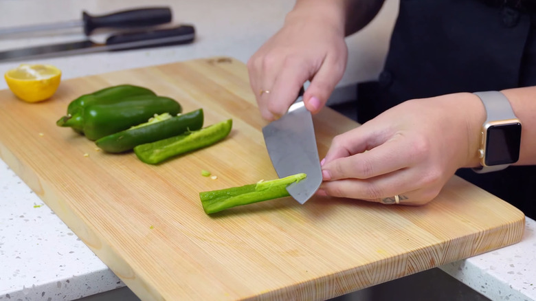 home chef slicing jalapeño pepper