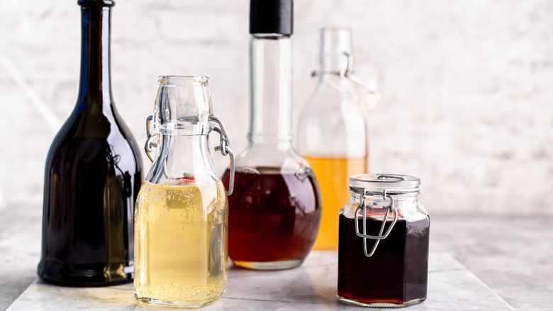 Assorted vinegars in glass jars