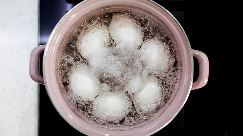 Eggs boiling in a pot