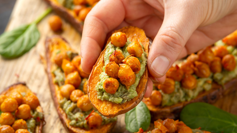 Person holding loaded sweet potato