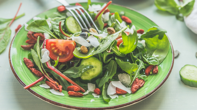 Bowl of salad with veggies and fork