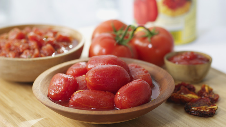 peeled Roma tomatoes in a bowl