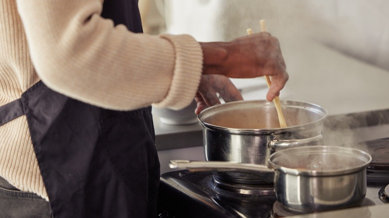 Person cooking with chopsticks