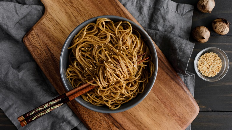 Bowl of noodles with chopsticks