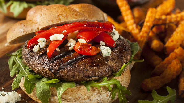 A burger with small tomatoes