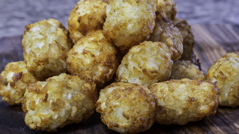 Tater tots on wood board