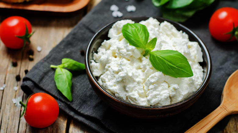 Bowl of ricotta with tomatoes and basil