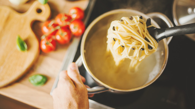 Boiling spaghetti in pot 