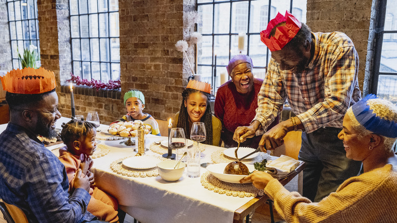 People enjoying Christmas pudding