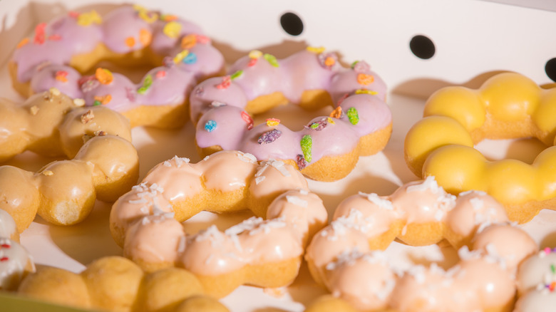 Colorful mochi doughnuts with glaze and toppings