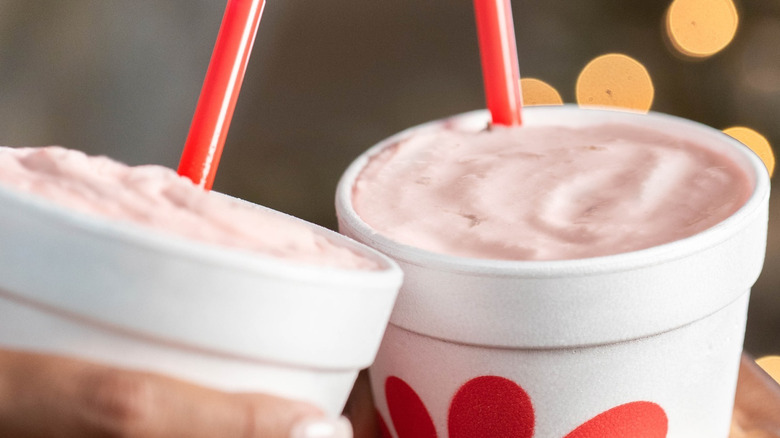 Hands holding Chick-Fil-A's peppermint milkshake