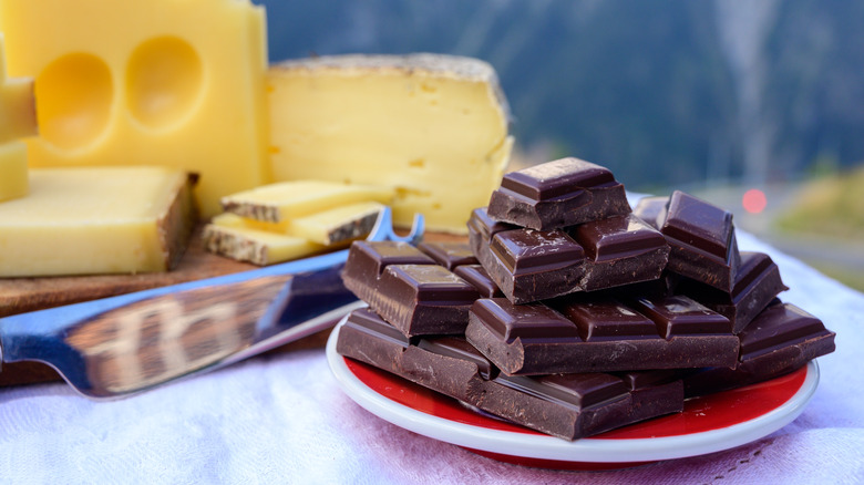 stack of chocolate in front of cheese wedges