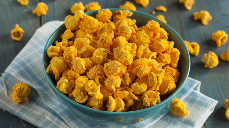 cheese popcorn spilling out of bowl