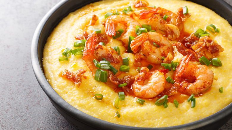 Shrimp and grits in black bowl