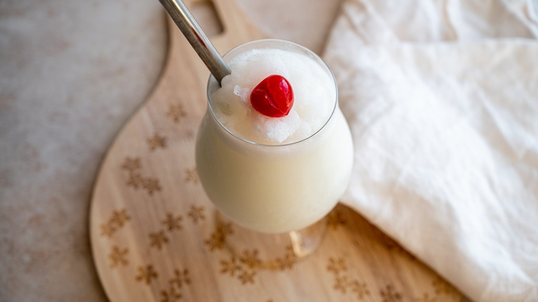 pina colada with cherry garnish