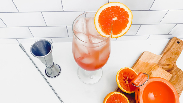 cocktail with orange wheel garnish