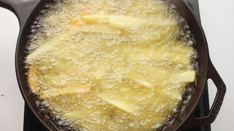 potatoes frying in oil