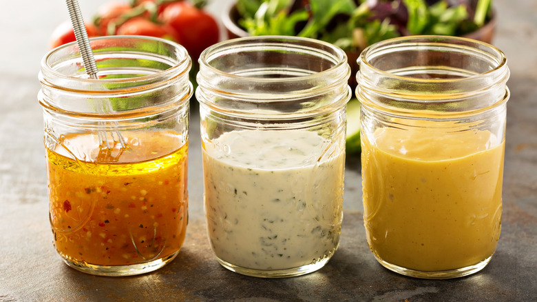 Trio of salad dressings in jars