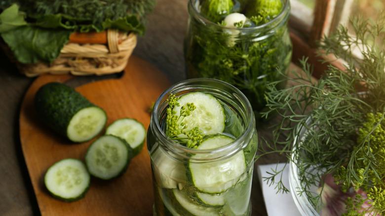 Pickles and herbs in jars