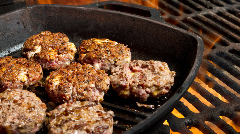 Grilled burgers in cast iron