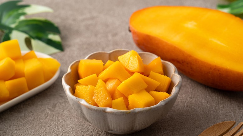 Diced mango in grey bowl