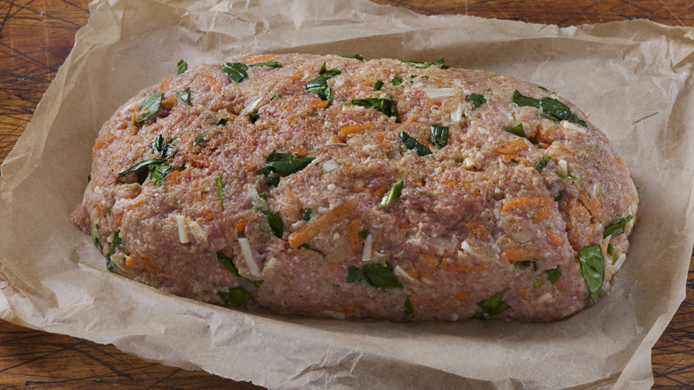 Raw meatloaf on a table