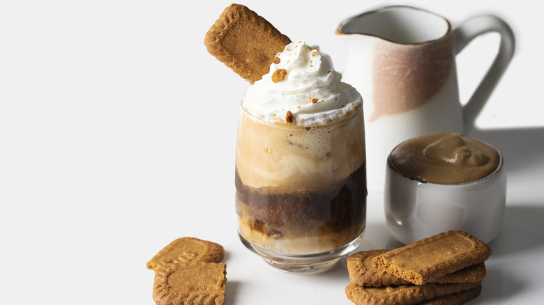 cookie butter latte and cookies on white background