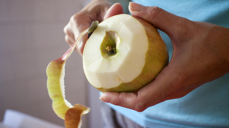 Cook peeling an apple