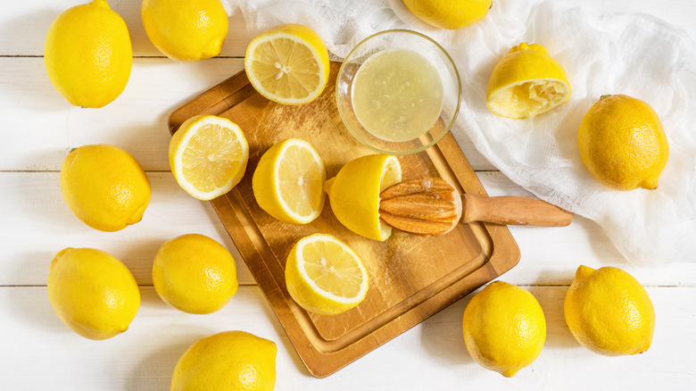 juicing lemons on cutting board