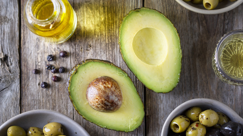 Fresh sliced avocados with peppercorns