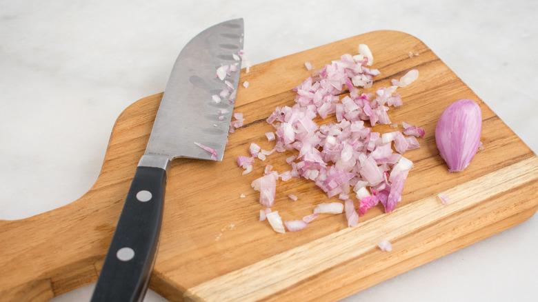 Diced shallots on cutting board