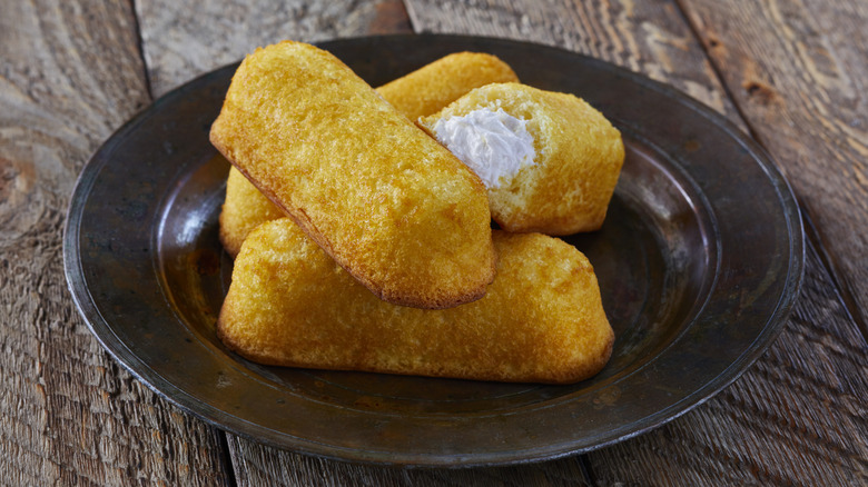 Twinkies stacked up on a plate