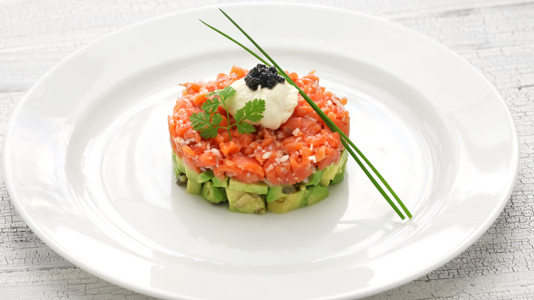 Salmon tartare on white plate