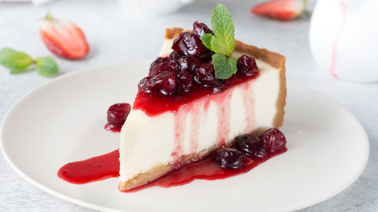 Slice of cheesecake with cranberry sauce