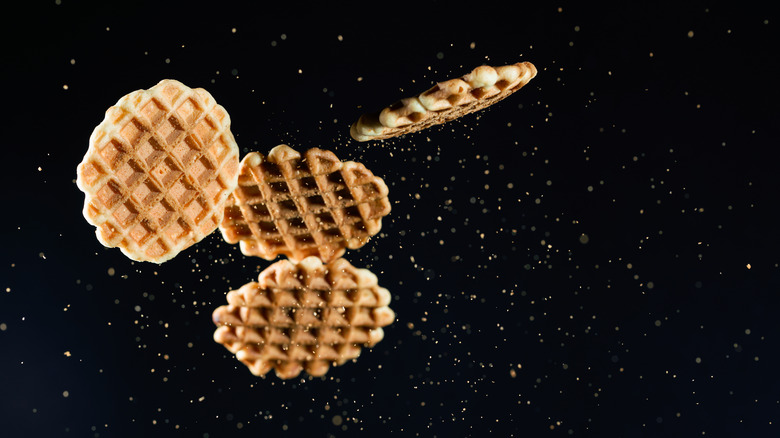 frozen waffles on black background