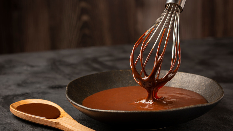 Whisk dipped in chocolate ganache