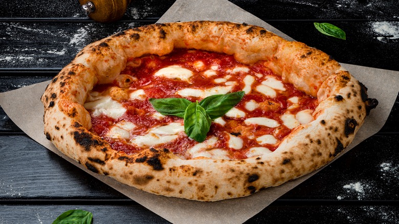 Fresh neopolitan pizza on parchment paper