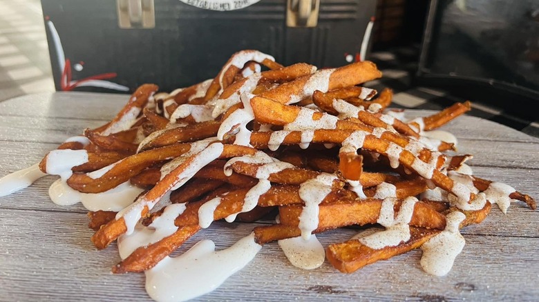 Sweet potato fries covered in marshmallow sauce