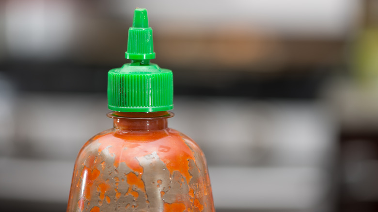 Close up of empty sriracha bottle nozzle