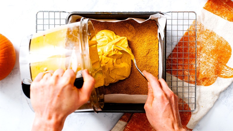 Pumpkin filling poured onto cookie crust