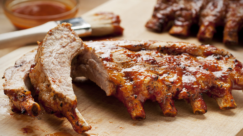 smoked ribs on a cutting board