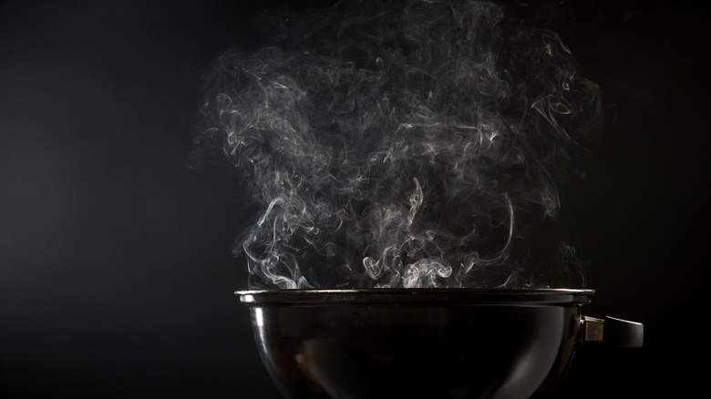 smoke coming from a charcoal grill