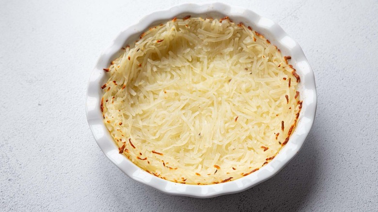 baked hash browns in a pie dish