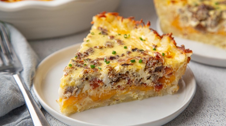 slice of quiche with a hash brown crust