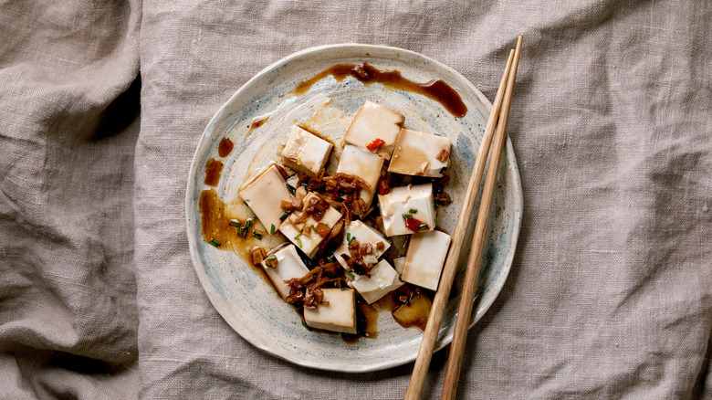 a plate of sauced tofu