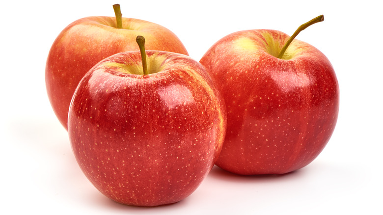three apples on white background